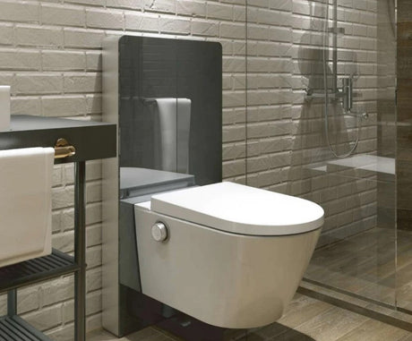 A small, luxury modern wetroom designed for a wheelchair, featuring a tankless Washloo Odyssey smart toilet mounted against clean white tiles.