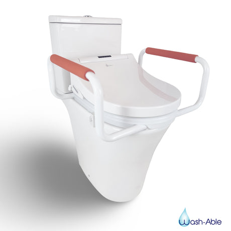 A close-up view of a 50mm toilet seat riser with integrated steel support handles fitted beneath a modern electronic bidet seat.